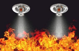 Image of Fire Sprinklers Spraying with fire background. Fire spr