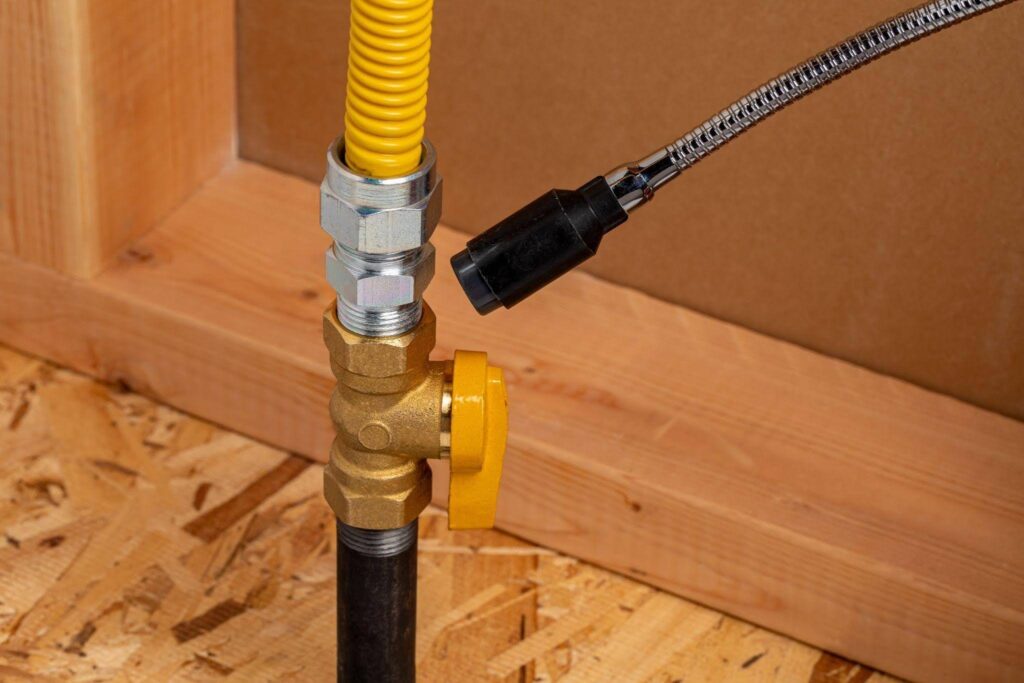 A hose is linked to a water pipe demonstrating a setup for irrigation or outdoor cleaning purposes