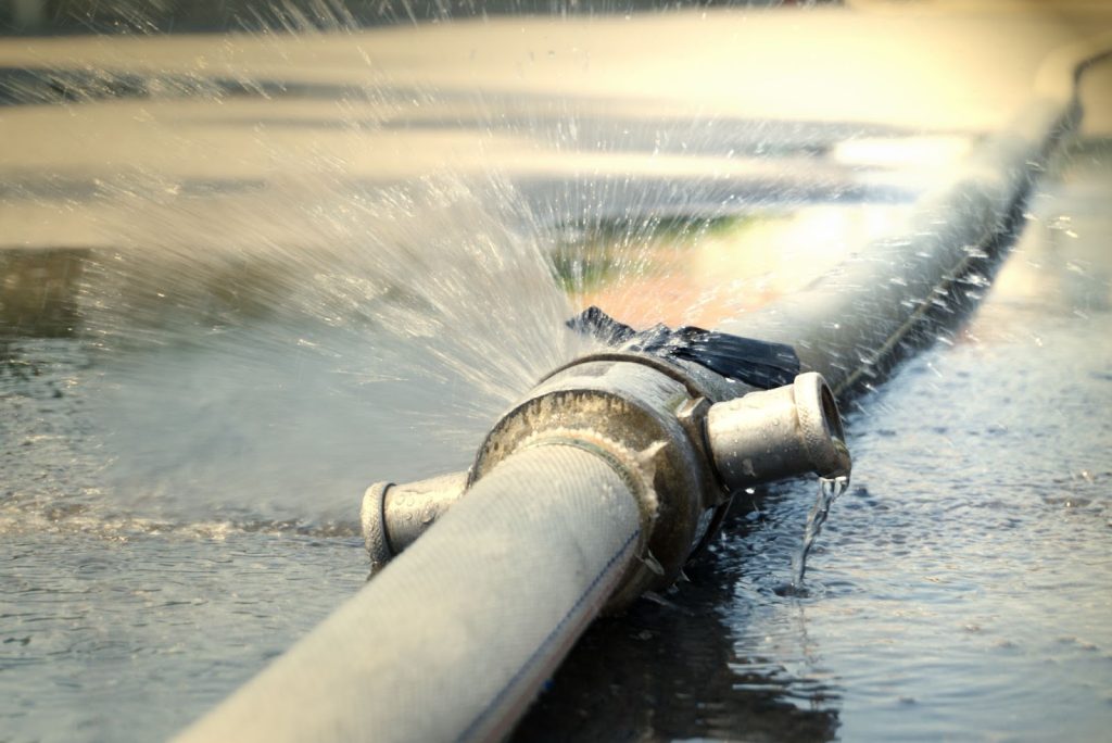 Burst water pipes causing flooding in building