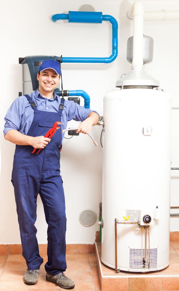 An individual in a plumber's uniform working on a plumbing issue with tools in hand.