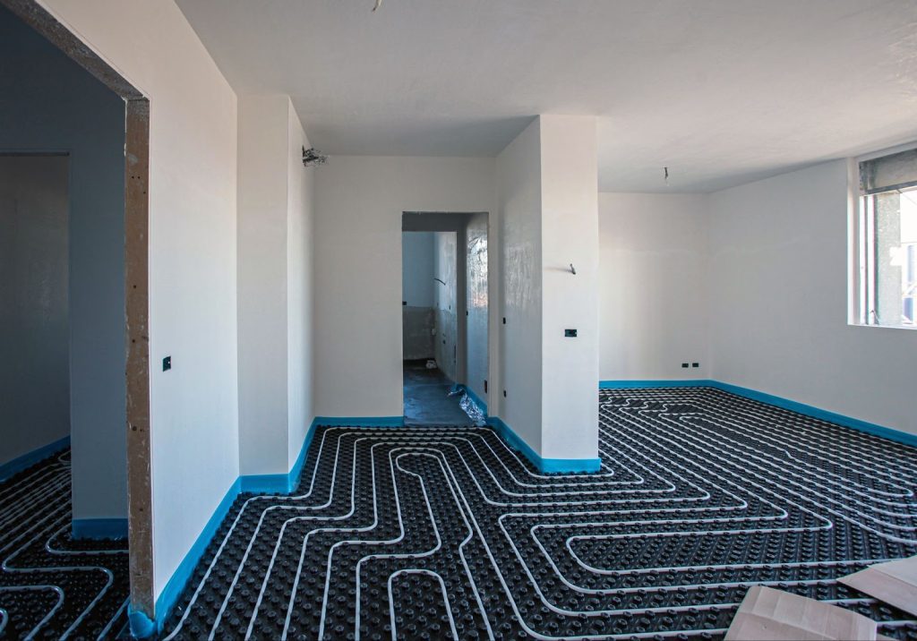 Radiant heating system in a room, with the floor being heated for comfortable temperature