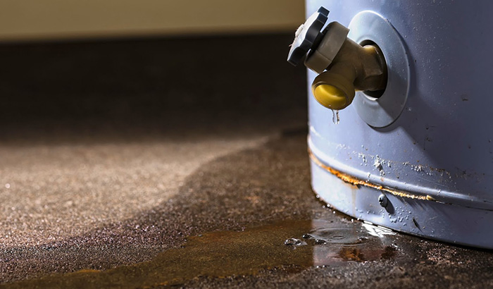 Water Leaking From A Burst Water Heater In An Apartment, Creating A Puddle On The Floor