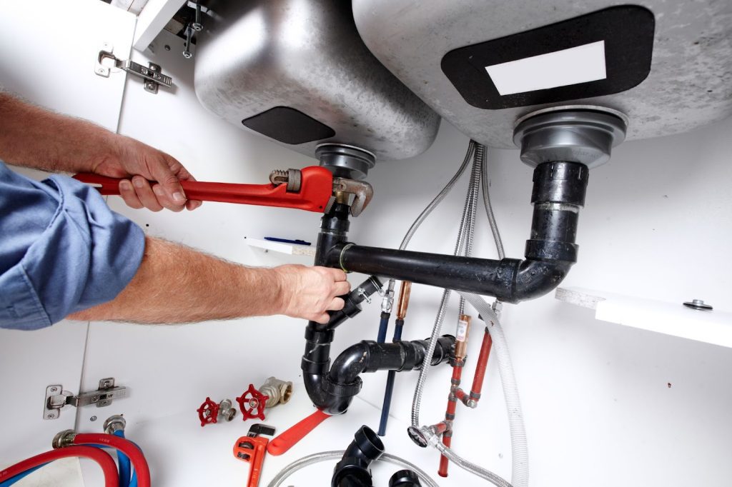 Professional commercial plumber providing services for commercial plumbing systems