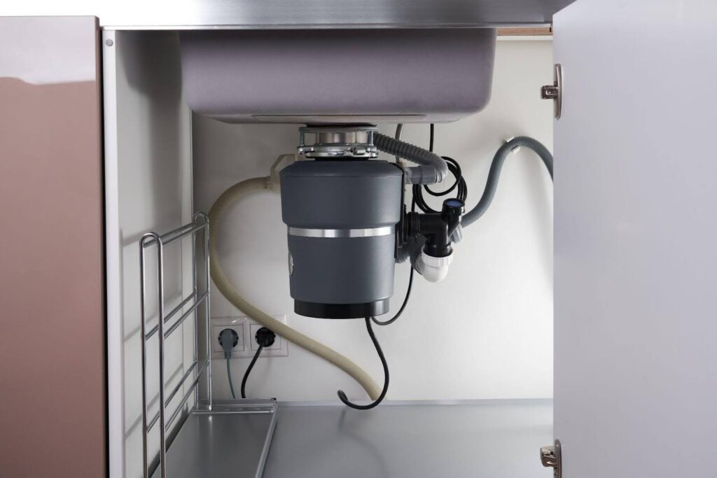 A kitchen sink with a water filter and faucet showcasing modern plumbing